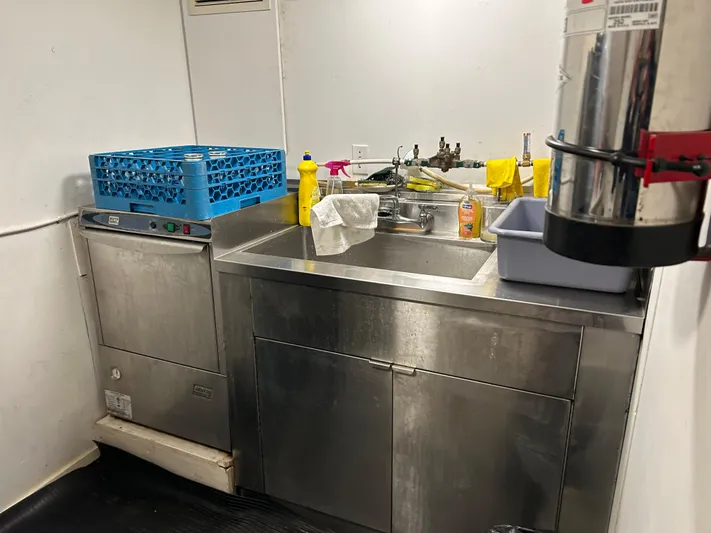 Eloquent Yacht Photos Pics Kitchen area on a 1990 Palmer Marine 70 Pilothouse with stainless steel sink and dishwasher.