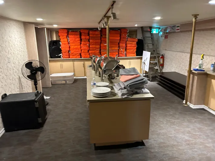 Eloquent Yacht Photos Pics Interior of 1990 Palmer Marine 70 Pilothouse with life jackets and buffet setup.