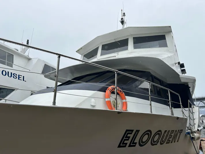 Eloquent Yacht Photos Pics 1990 Palmer Marine 70 Pilothouse yacht docked, featuring "Eloquent" on the hull.