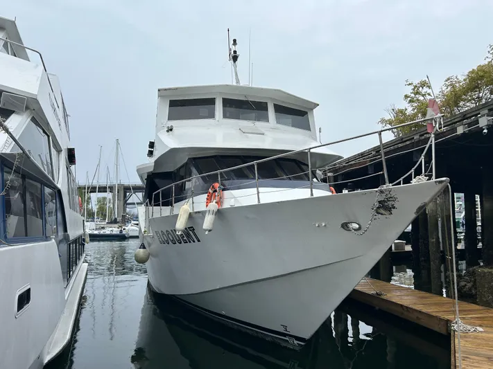 Eloquent Yacht Photos Pics 1990 Palmer Marine 70 Pilothouse yacht docked at marina, front view.