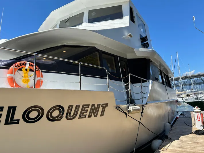 Eloquent Yacht Photos Pics 1990 Palmer Marine 70 Pilothouse yacht docked at marina under clear blue sky.