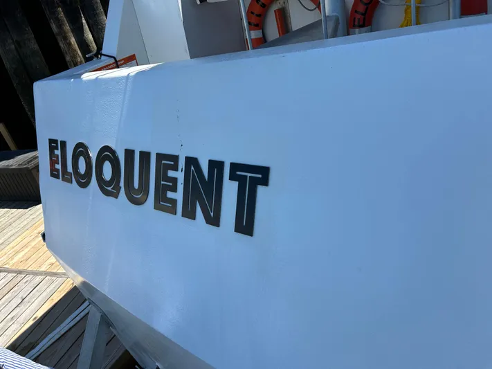 Eloquent Yacht Photos Pics Palmer Marine 70 Pilothouse 1990 boat named "Eloquent" docked with visible life rings.