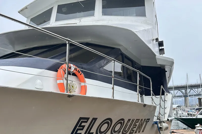 Eloquent Yacht Photos Pics Palmer Marine 70 Pilothouse yacht, 1990 model, docked with visible lifebuoy and name "Eloquent."
