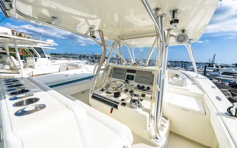 Liquid Asset Yacht Photos Pics 2012 SeaVee 39 LE boat cockpit with navigation equipment and marina view.