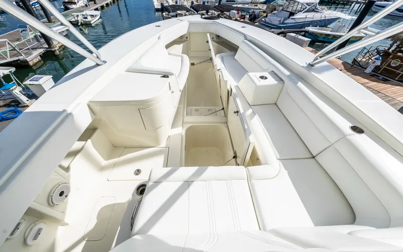Liquid Asset Yacht Photos Pics 2012 SeaVee 39 LE boat interior with spacious seating and storage at a marina.