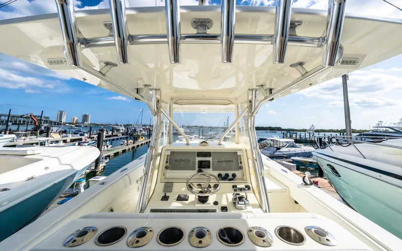 Liquid Asset Yacht Photos Pics 2012 SeaVee 39 LE boat dashboard with marina view, featuring modern controls and sleek design.