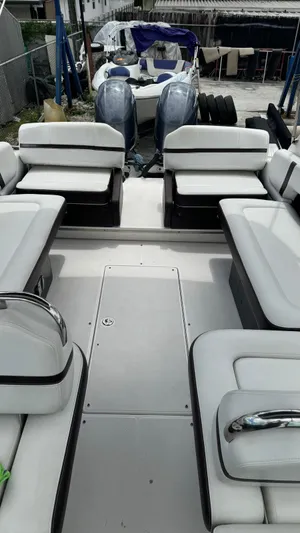  Yacht Photos Pics 2017 Regal 29 OBX boat interior with white seating and dual outboard motors.