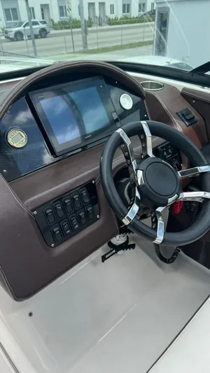  Yacht Photos Pics 2017 Regal 29 OBX boat dashboard with steering wheel and control panel.