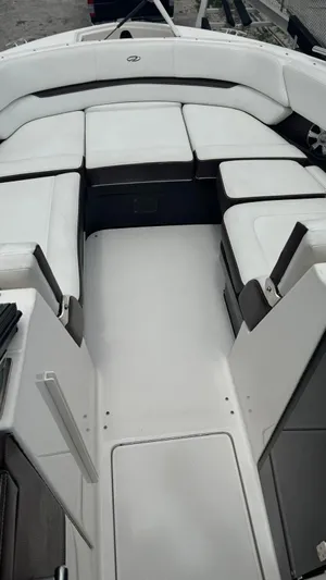  Yacht Photos Pics 2017 Regal 29 OBX boat interior with white cushioned seating and spacious layout.