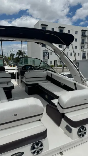  Yacht Photos Pics 2017 Regal 29 OBX boat with spacious seating, modern design, and urban backdrop.