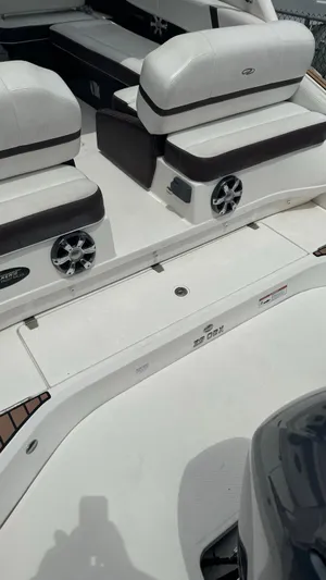  Yacht Photos Pics 2017 Regal 29 OBX boat interior with white seating and speaker system.