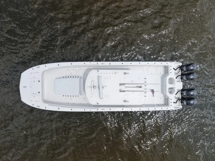  Yacht Photos Pics Overhead view of a 2018 Invincible 40 Catamaran on water, featuring triple outboard engines.