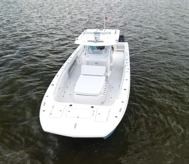  Yacht Photos Pics 2018 Invincible 40 Catamaran on water, aerial view, white hull, American flag.