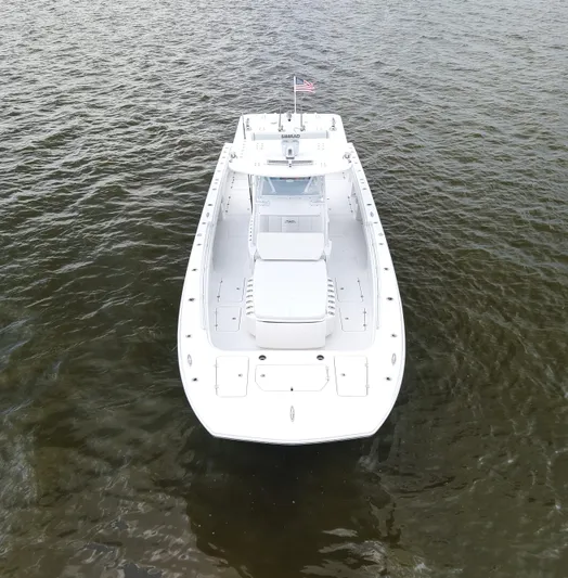  Yacht Photos Pics 2018 Invincible 40 Catamaran on water, aerial view, white hull, American flag.