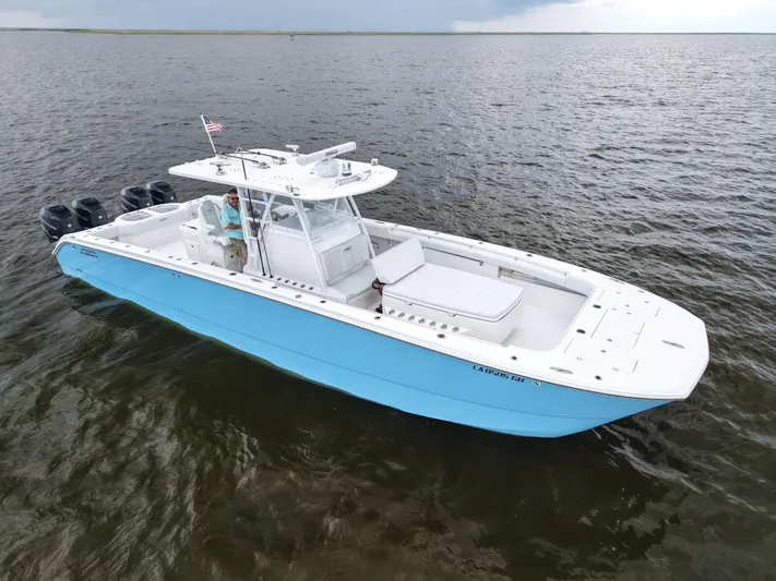  Yacht Photos Pics Invincible 40 Catamaran 2018 on open water, featuring sleek design and multiple engines.