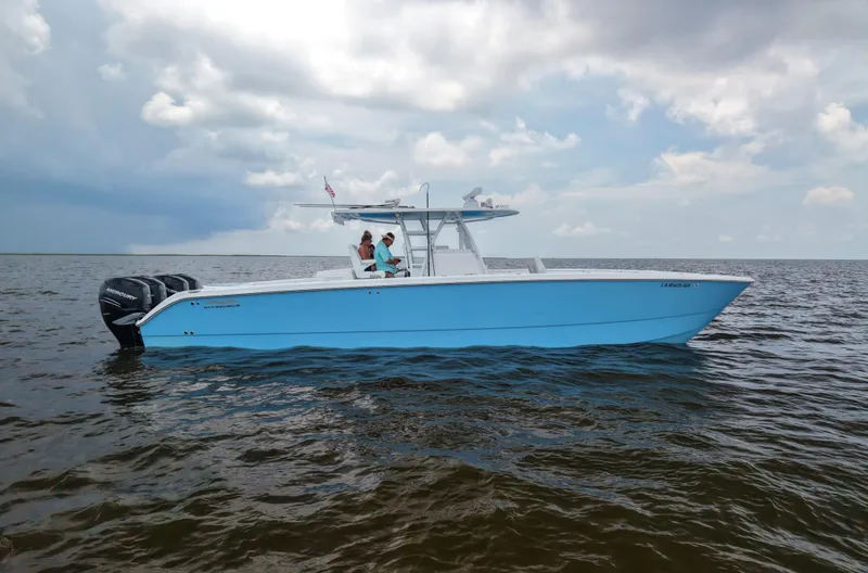  Yacht Photos Pics 2018 Invincible 40 Catamaran on open water under cloudy sky.