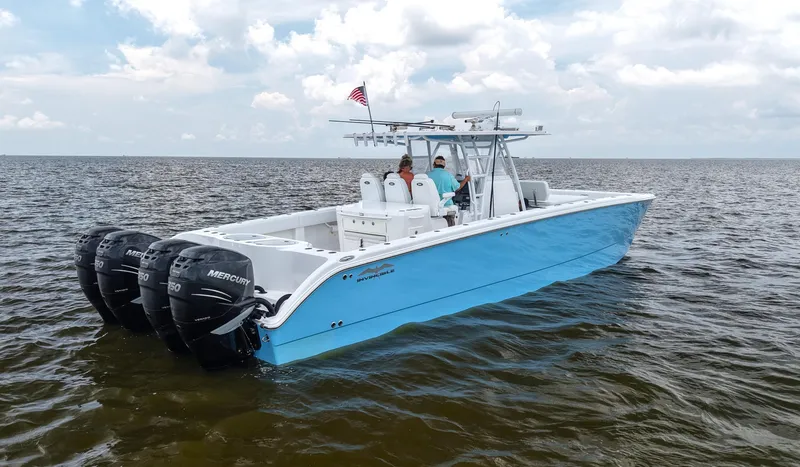  Yacht Photos Pics 2018 Invincible 40 Catamaran with four Mercury engines on open water.