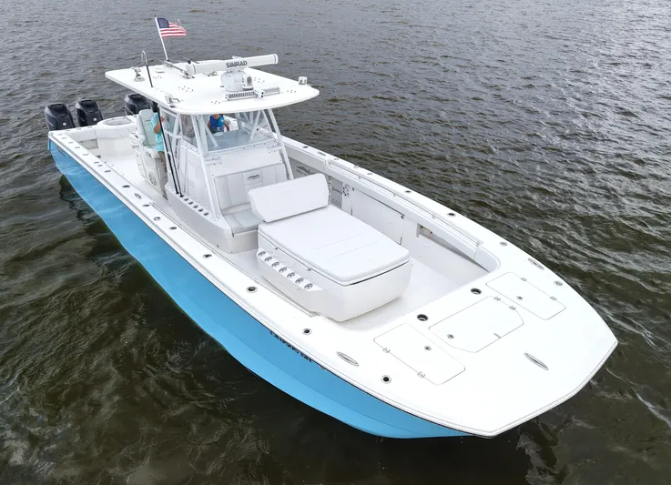  Yacht Photos Pics 2018 Invincible 40 Catamaran on water, featuring sleek design and American flag.