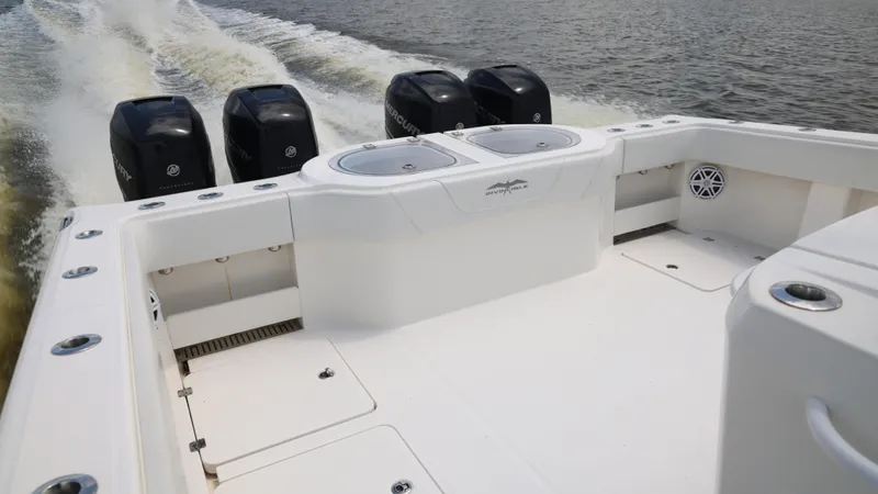  Yacht Photos Pics 2018 Invincible 40 Catamaran with four outboard engines cruising on water.