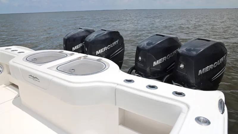  Yacht Photos Pics 2018 Invincible 40 Catamaran with four Mercury outboard engines on open water.