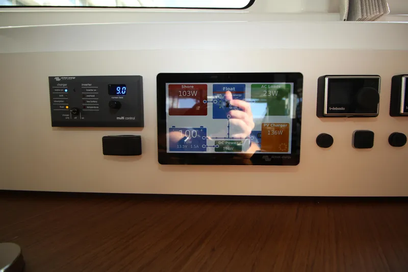 Vela Yacht Photos Pics Control panel of a 2021 Lagoon 46 yacht with digital display and buttons.