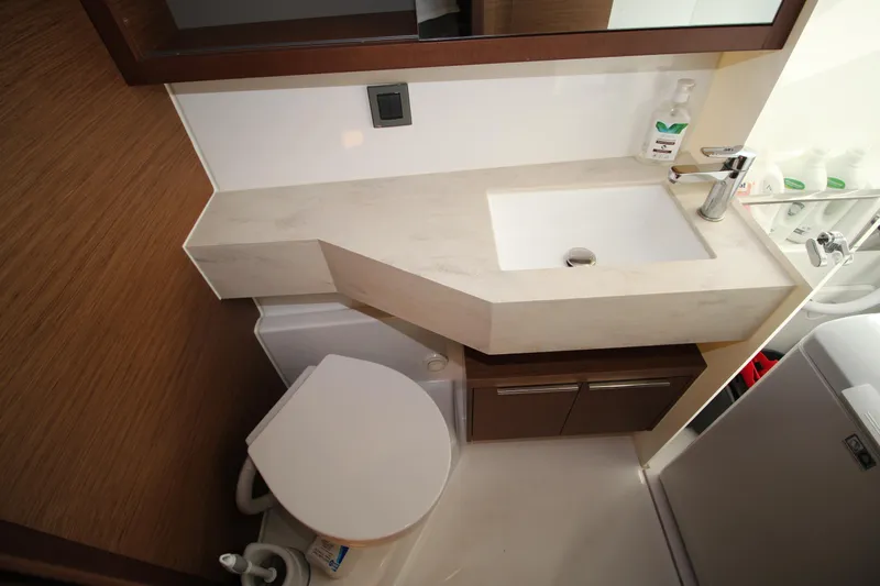 Vela Yacht Photos Pics Modern bathroom in 2021 Lagoon 46 yacht with sink and toilet.