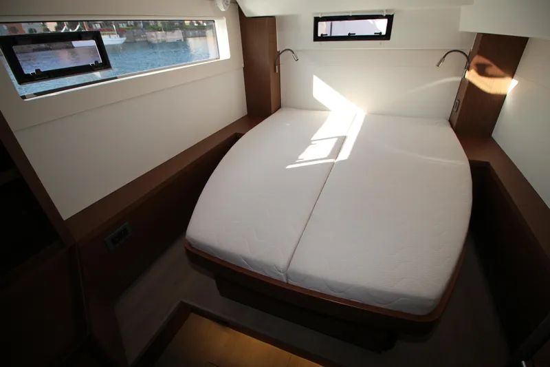 Vela Yacht Photos Pics Interior cabin of 2021 Lagoon 46 yacht with double bed and windows.