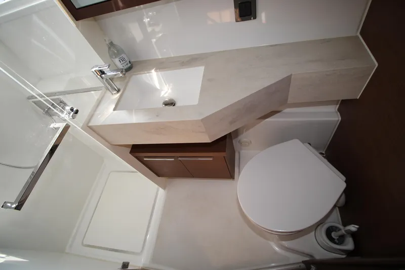 Vela Yacht Photos Pics Modern bathroom in 2021 Lagoon 46 yacht with sleek sink and toilet design.