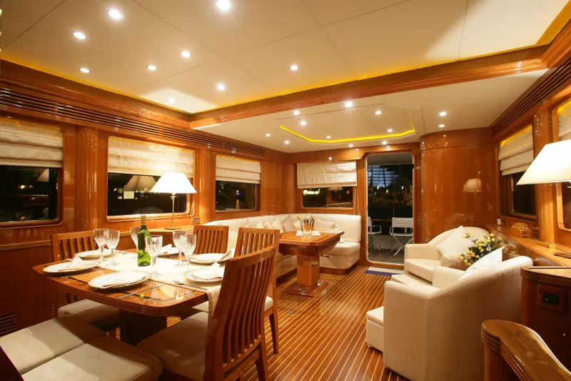  Yacht Photos Pics Luxurious interior of 2026 Selene 62 yacht with elegant dining and seating area.