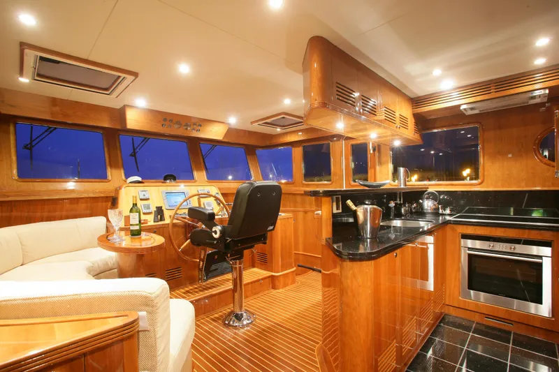  Yacht Photos Pics Luxurious interior of 2026 Selene 62 yacht with modern kitchen and navigation area.