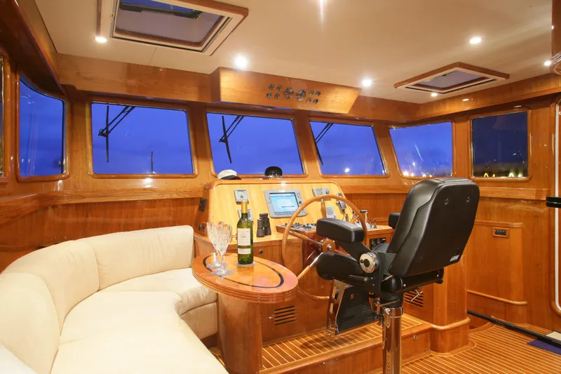  Yacht Photos Pics Luxurious interior of 2026 Selene 62 yacht with wooden finishes and modern navigation equipment.