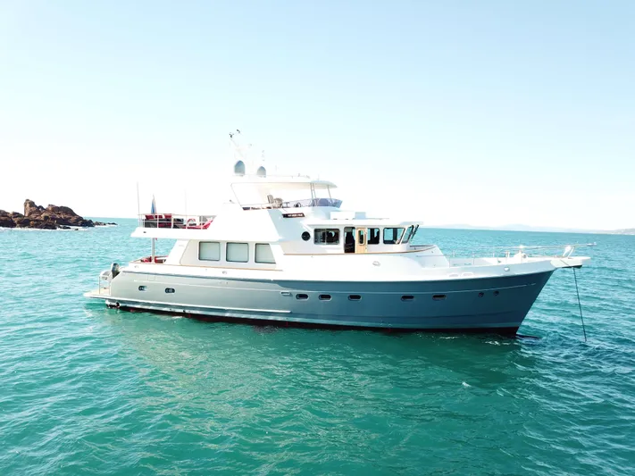  Yacht Photos Pics Luxurious 2026 Selene 62 yacht cruising on clear blue waters.