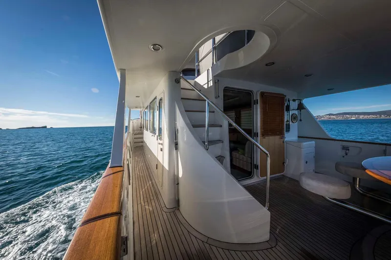  Yacht Photos Pics Luxurious Selene 62 yacht deck with ocean view, featuring elegant wood finishes, 2026 model.