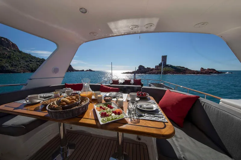  Yacht Photos Pics Luxurious breakfast setup on Selene 62 yacht, 2026, with scenic ocean view.