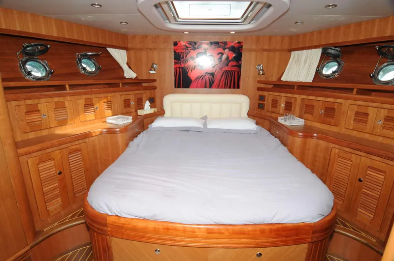  Yacht Photos Pics Luxurious cabin interior of 2026 Selene 62 yacht with wood paneling and skylight.