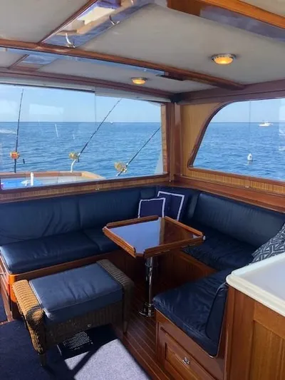 Moses Yacht Photos Pics Luxurious 2003 Lyman-Morse Wesmac Sportfish Cruiser interior with ocean view and comfortable seating.