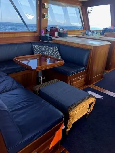 Moses Yacht Photos Pics Luxurious 2003 Lyman-Morse Wesmac Sportfish Cruiser interior with leather seating and wooden accents.