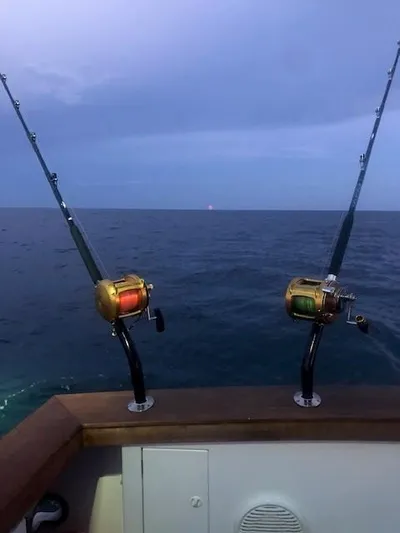 Moses Yacht Photos Pics Fishing rods on a 2003 Lyman-Morse Wesmac Sportfish Cruiser at sea.