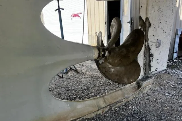 Moses Yacht Photos Pics Propeller of 2003 Lyman-Morse Wesmac Sportfish Cruiser in a maintenance area.