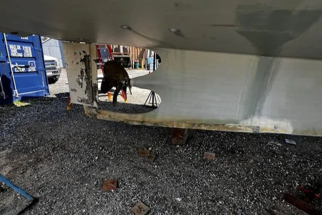 Moses Yacht Photos Pics 2003 Lyman-Morse Wesmac Sportfish Cruiser under maintenance, showing hull and propeller.