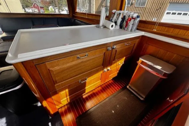 Moses Yacht Photos Pics 2003 Lyman-Morse Wesmac Sportfish Cruiser interior with wooden cabinetry and countertop.