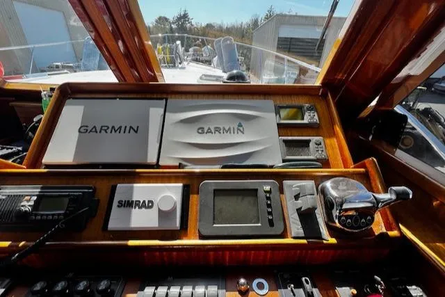 Moses Yacht Photos Pics Control panel of 2003 Lyman-Morse Wesmac Sportfish Cruiser with Garmin and Simrad equipment.