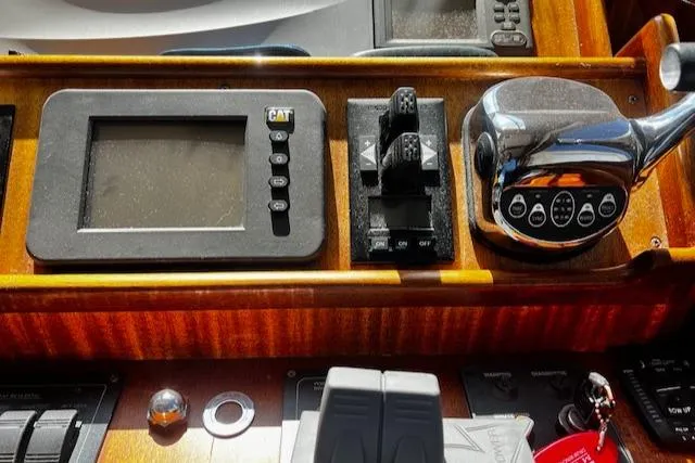 Moses Yacht Photos Pics Control panel of 2003 Lyman-Morse Wesmac Sportfish Cruiser with navigation and throttle controls.