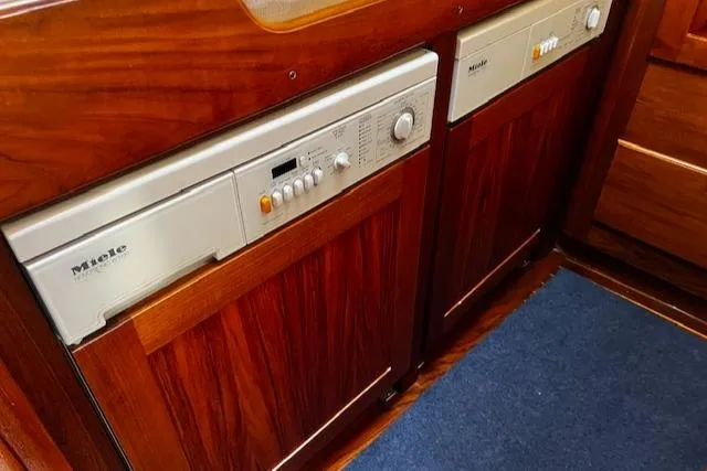 Moses Yacht Photos Pics 2003 Lyman-Morse Wesmac Sportfish Cruiser interior with Miele appliances and wooden cabinetry.