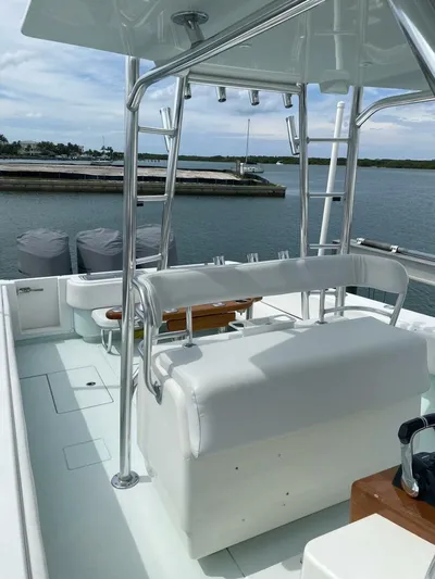 Nauty C Bouys Yacht Photos Pics 2012 Contender 39 ST boat with sleek design, spacious deck, and modern amenities docked by the water.