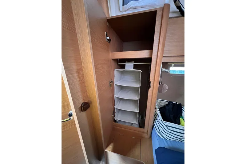 Cum Laude Yacht Photos Pics Interior storage of 2017 Dufour 512 Grand Large yacht with hanging organizer.