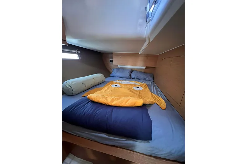 Cum Laude Yacht Photos Pics Cozy cabin interior of 2017 Dufour 512 Grand Large with playful bedding.