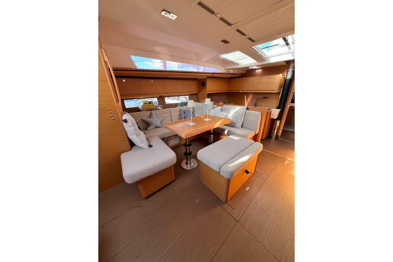 Cum Laude Yacht Photos Pics Luxurious interior of 2017 Dufour 512 Grand Large yacht with elegant seating and dining area.
