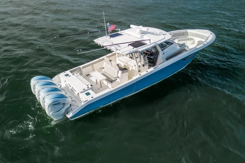  Yacht Photos Pics 2022 Pursuit S 428 Sport boat with four Yamaha engines on open water.