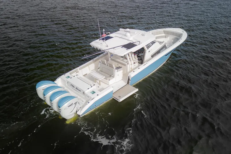  Yacht Photos Pics 2022 Pursuit S 428 Sport boat with triple Yamaha engines on open water.